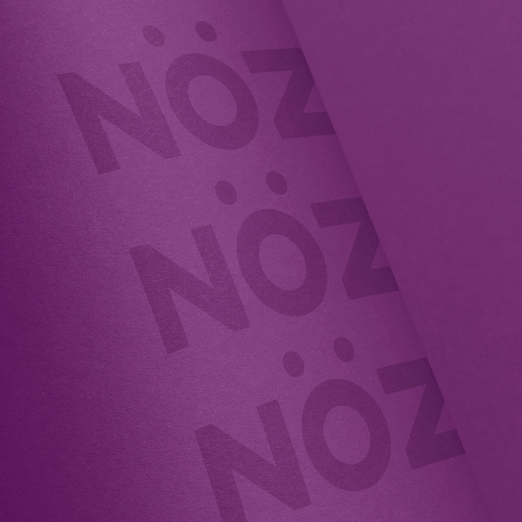 Close up view of Noz Sunscreen Stick in purple