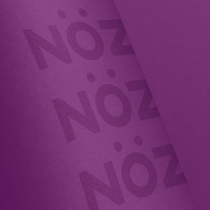 Close up view of Noz Sunscreen Stick in purple