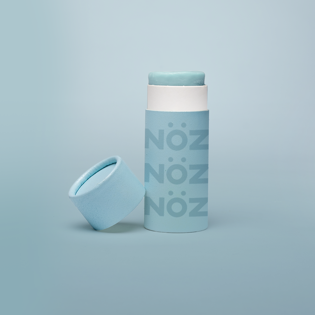 Cap off view of Noz Sunscreen Stick in blue