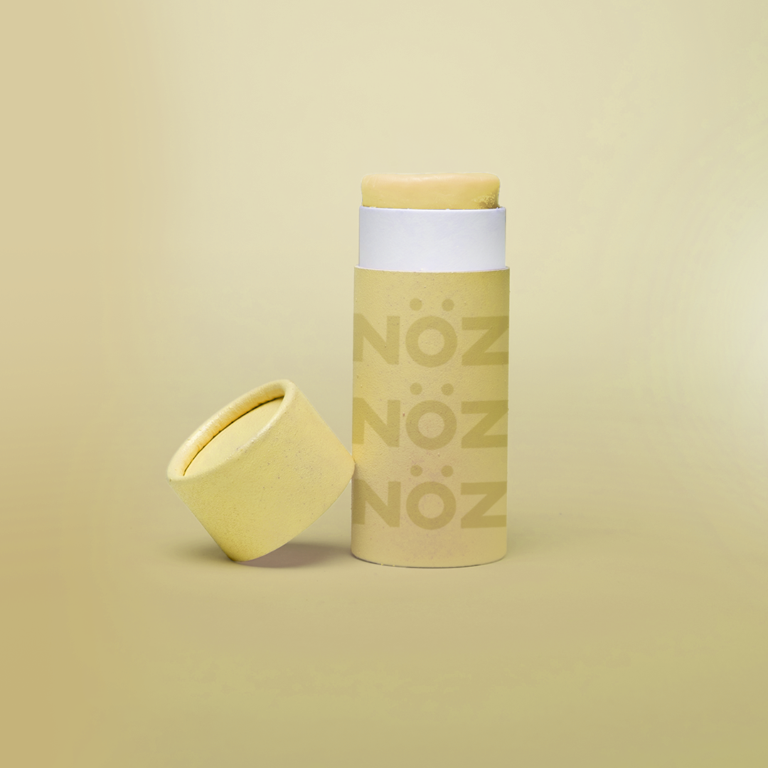 Cap off view of Noz Sunscreen Stick in yellow 